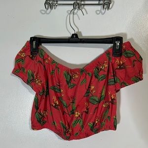 Salmon colored drop shoulder crop top with flowers/leaves